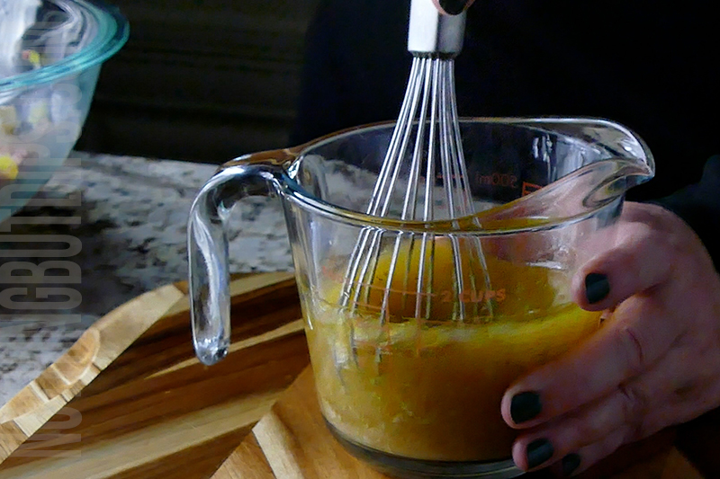 whisking the vinaigrette to add to Italian sub dip