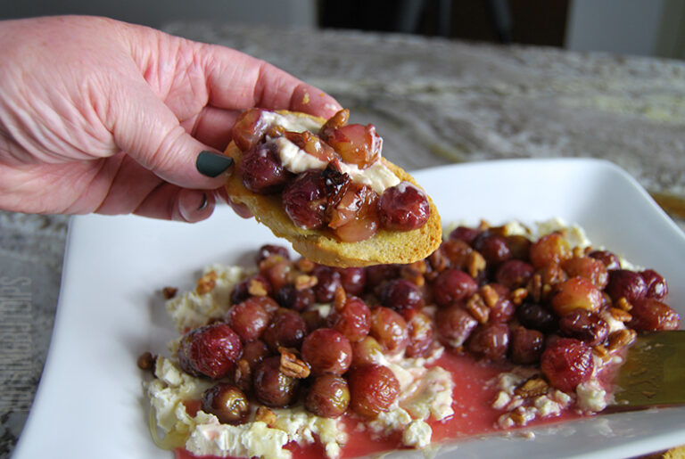 easy appetizer roasted grapes on boursin cheese served on garlic toast