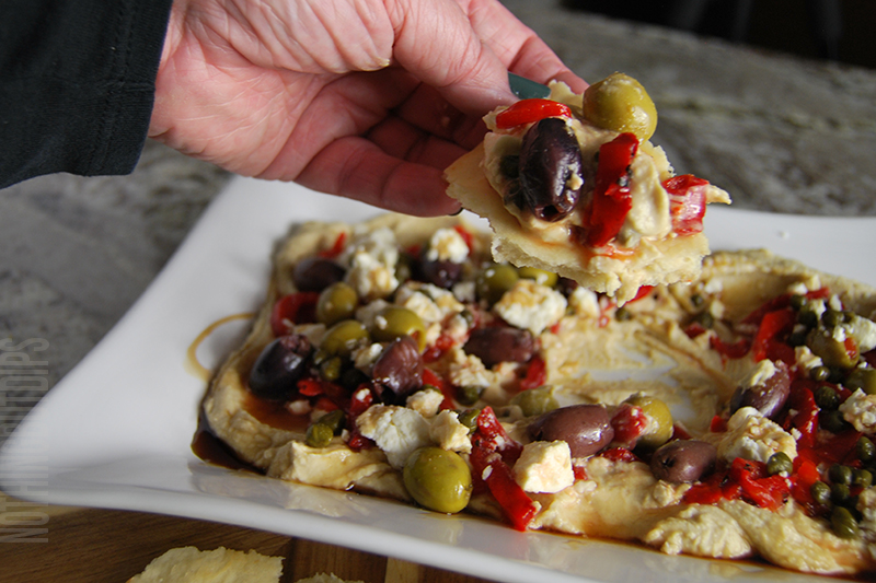 easy 5-minute dip layered hummus served on pita bread