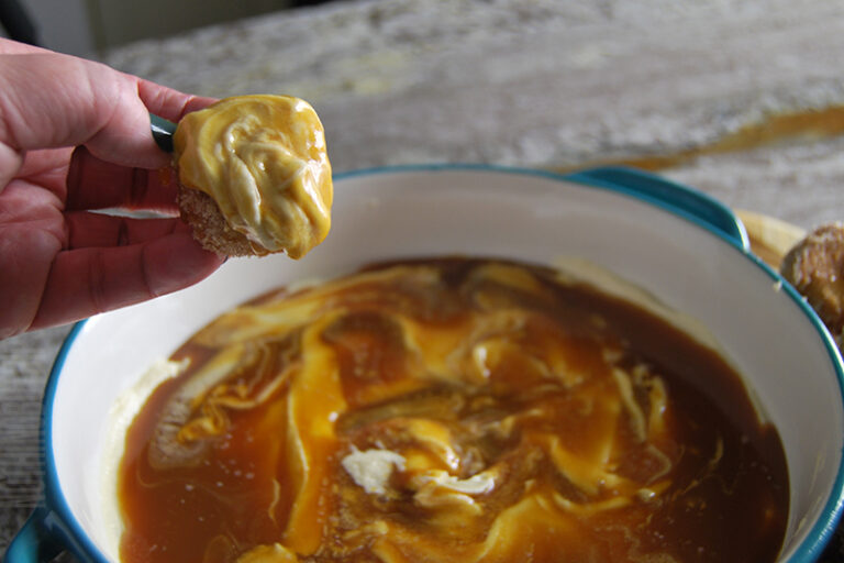 simple salted caramel dip served on a homemade baked donut hole