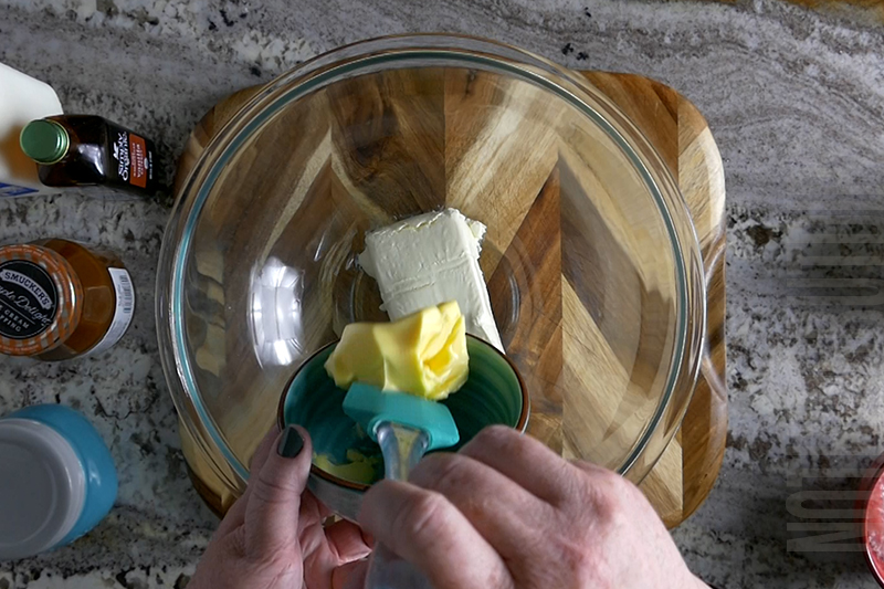 adding butter to the mixing bowl