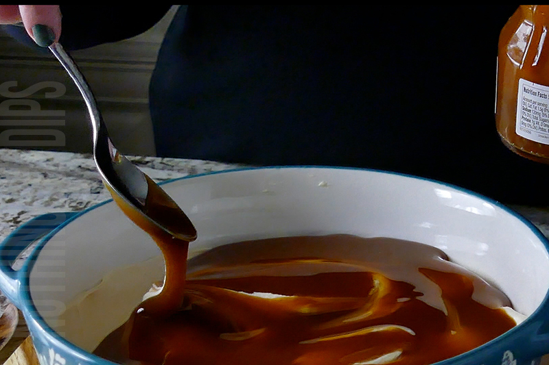spreading out the caramel sauce on top of the salted caramel dip
