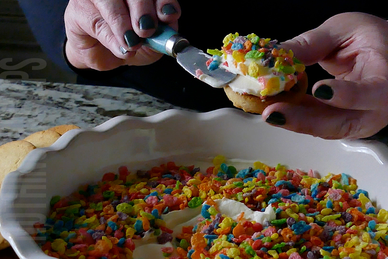 easy cereal and milk dip made with Fruity Pebbles served on a shortbread cookie