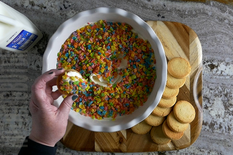 easy cereal and milk dip made with Fruity Pebbles served on a shortbread cookie