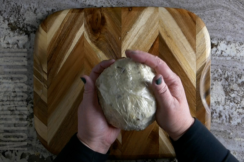 forming the ingredients into a ball to create a classic cheese ball