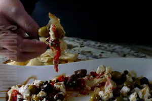 easy 5-minute dip layered hummus served on pita bread