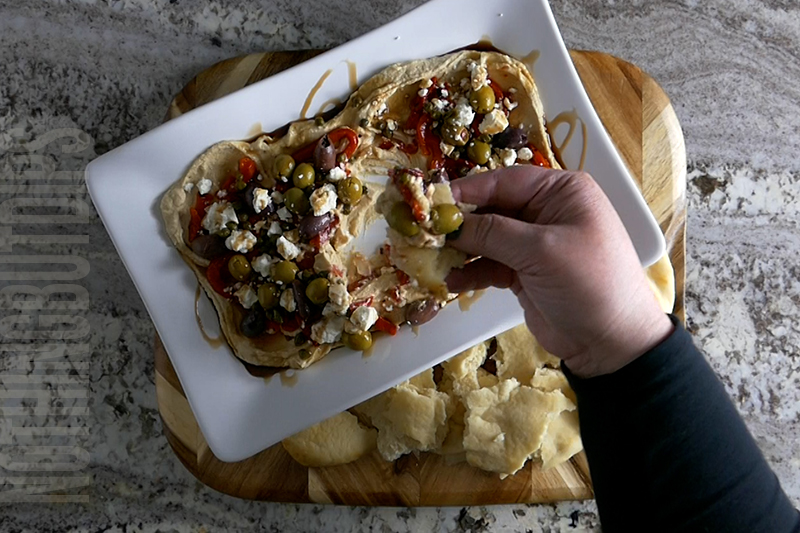 easy 5-minute dip layered hummus served on pita bread