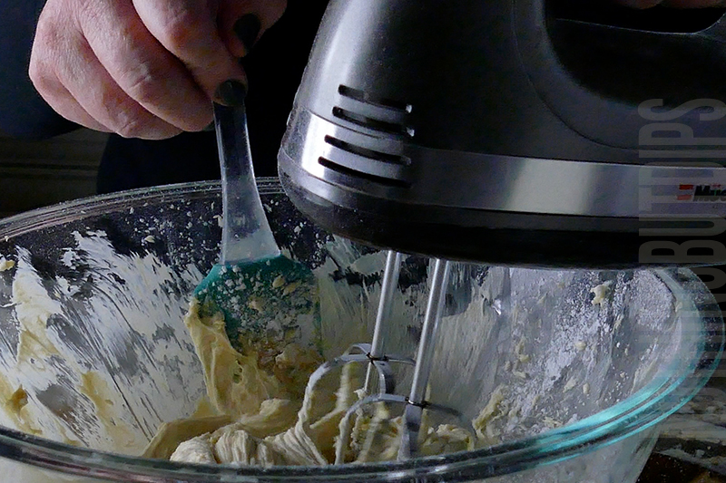mixing the ingredients with a hand mixer to make salted caramel dip