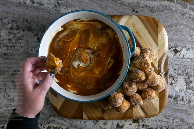 simple salted caramel dip served on a homemade baked donut hole