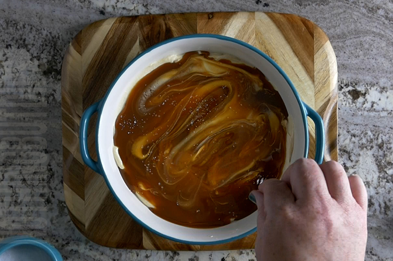 adding a pinch of salt to the top of the salted caramel dip