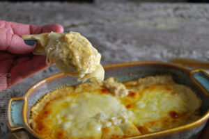 easy baked artichoke dip served on pita