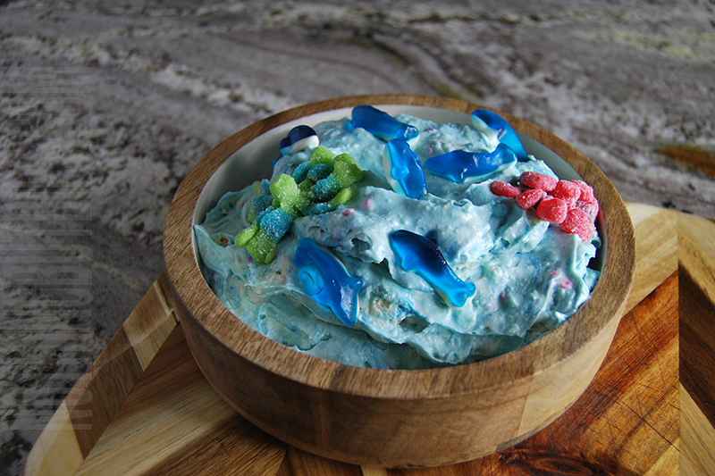 Under the sea dip with gummy sharks and octopus on top 