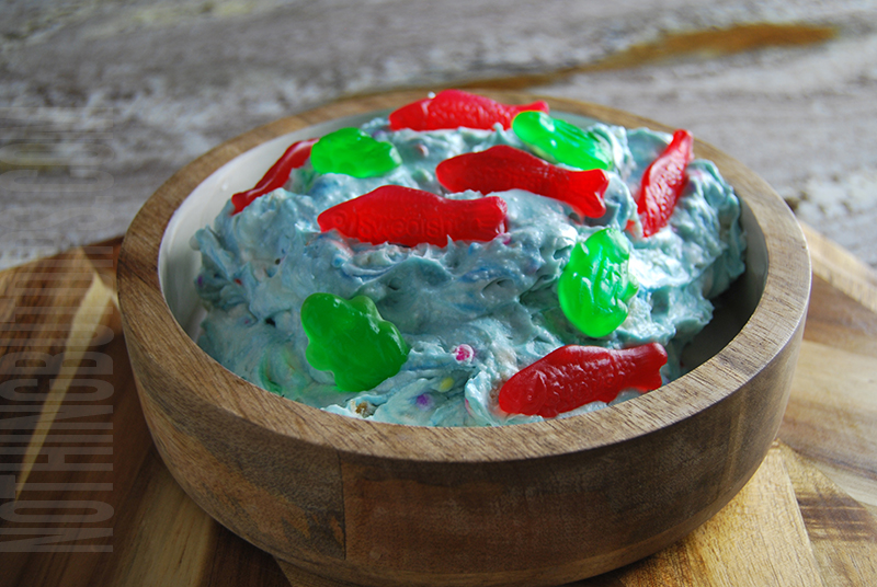 Pond life dip with gummy frogs and fish on top