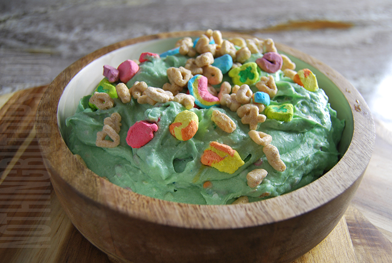 Green St. Patrick's Day dip with Lucky Charms cereal on top 