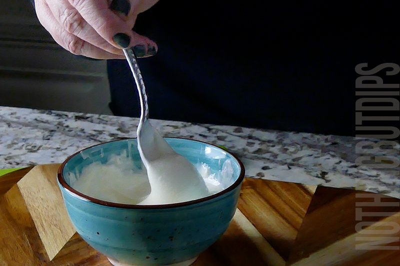 stirring the melted white chocolate