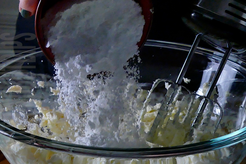adding powdered sugar to the base for the banana split dip