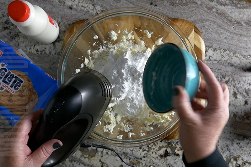 adding powdered sugar to the base for the cookies and milk dip