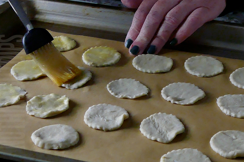 brushing the puff pastry with egg wash