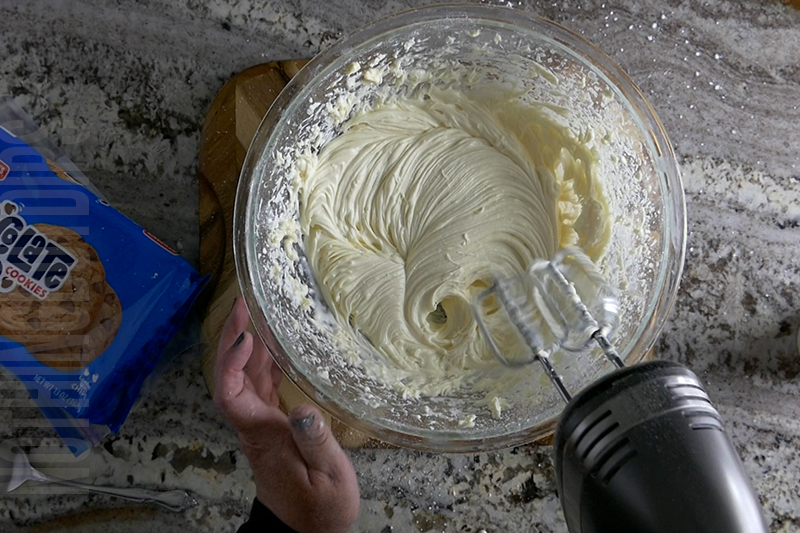mixing the cream for the base of the cookies and milk dip