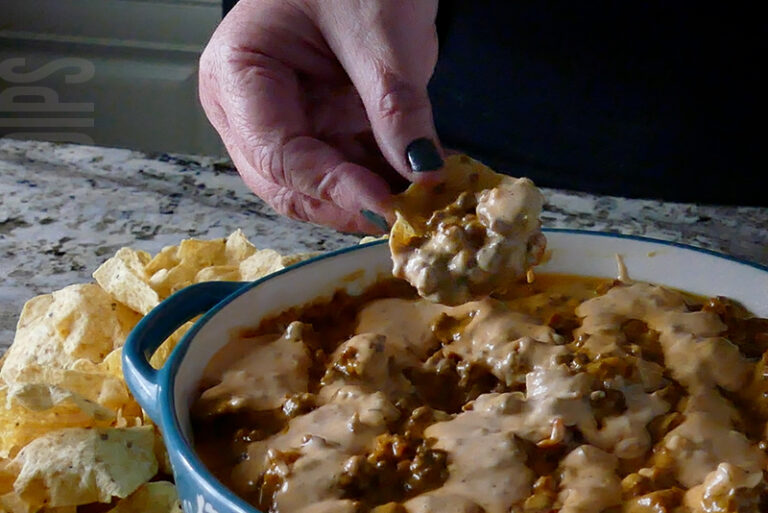 crockpot smash burger dip served on a tortilla chip
