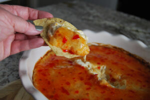Easy Baked Crab Rangoon Dip served on a tortilla