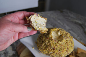 delicious jalapeno popper cheese ball served on a cracker