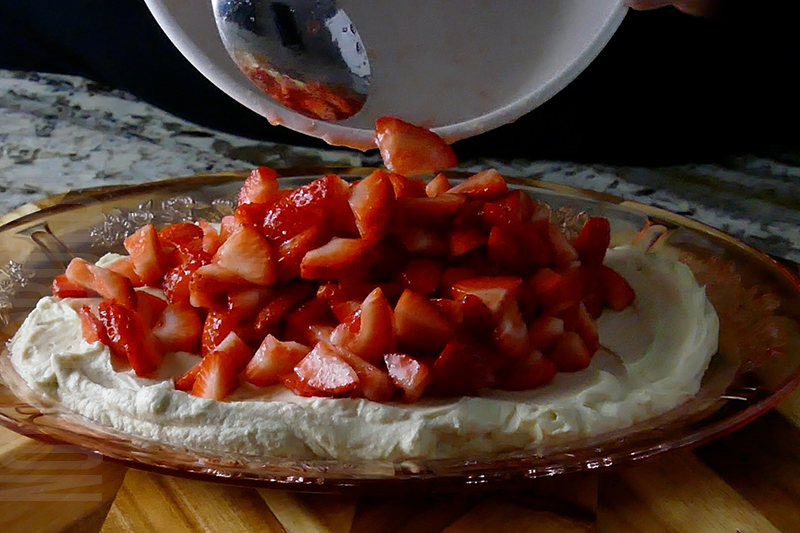 add strawberries to the top of the cream