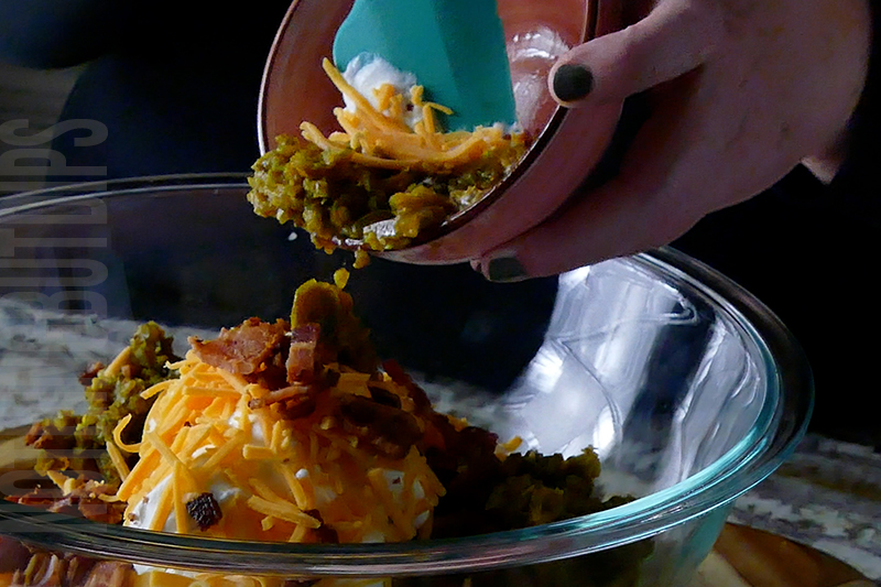 adding minced jalapeno peppers to the jalapeno popper cheese ball base