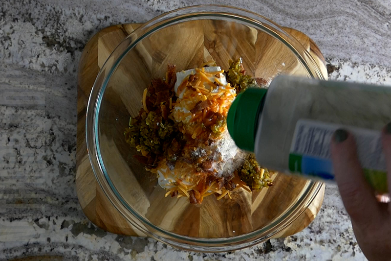 adding ranch powder to the jalapeno popper cheese ball base