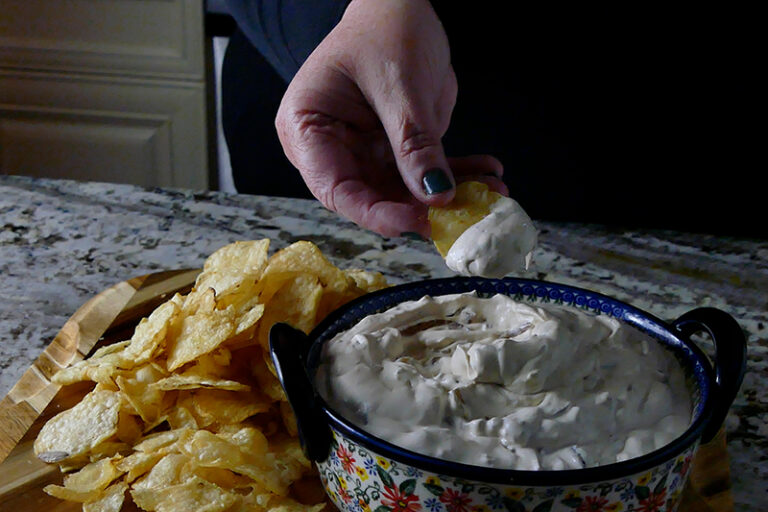 classic homemade French onion dip served with potato chips