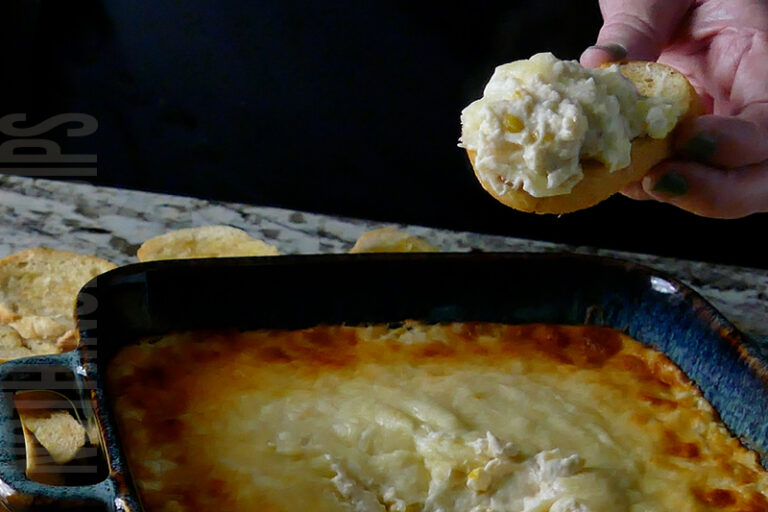 Baked Corn and Crab Cheese Dip served on toasted garlic bread