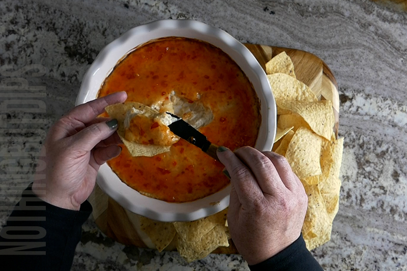 Easy Baked Crab Rangoon Dip served on a tortilla