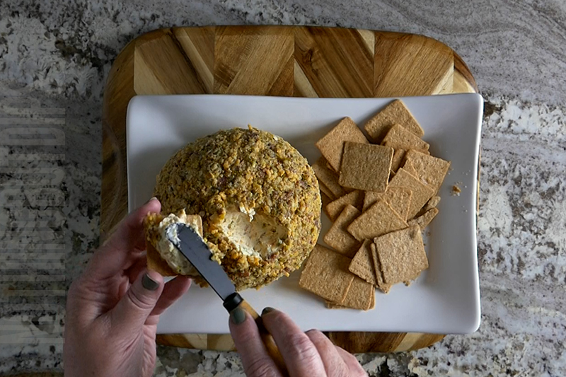 delicious jalapeno popper cheese ball served on a cracker