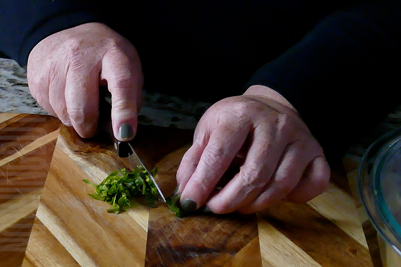 mincing fresh basil