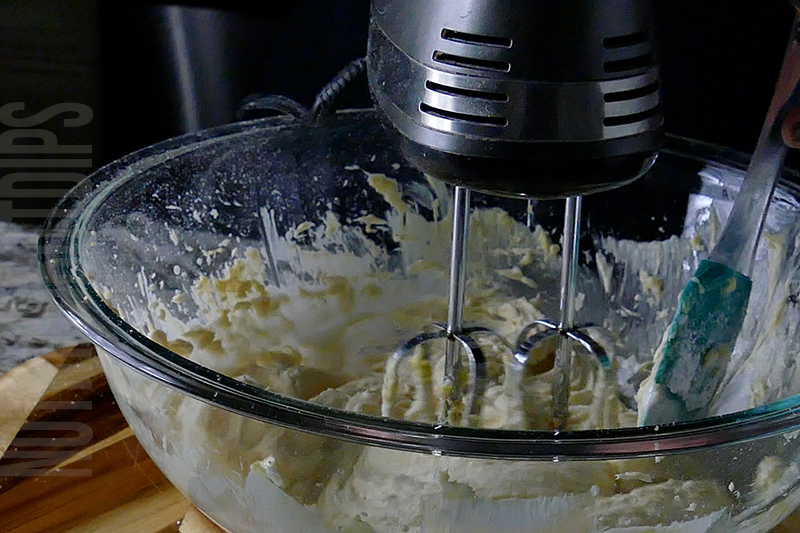 mixing the cream for the strawberry pretzel salad dip