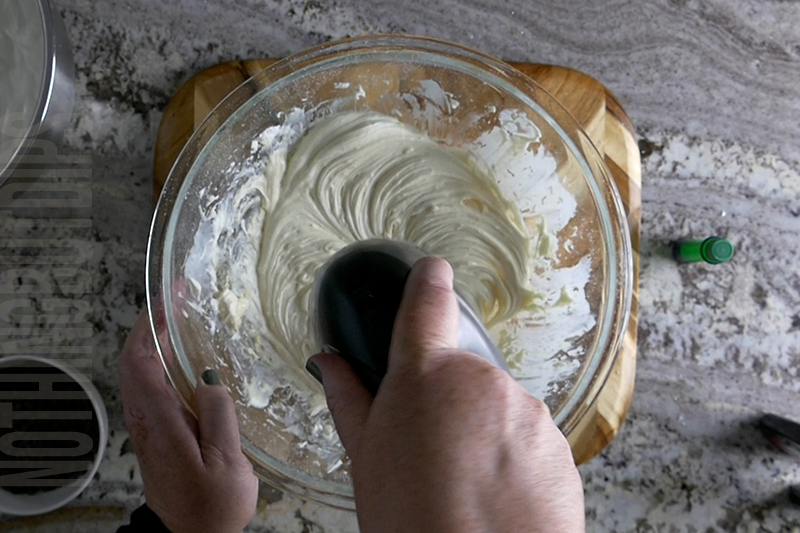 mixing the ingredients for mint chocolate chip dip