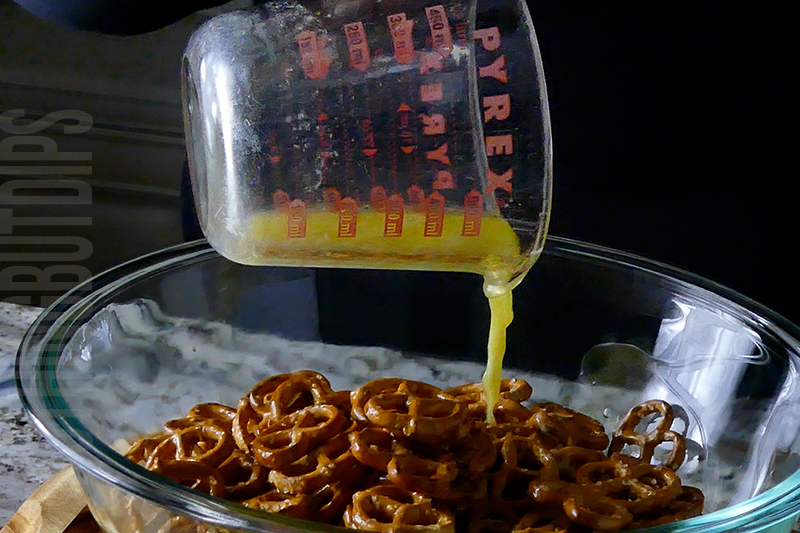 pour melted butter over the pretzels