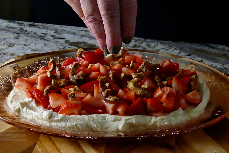 sprinkle crushed sugar pretzels to the top of your strawberry pretzel salad dip