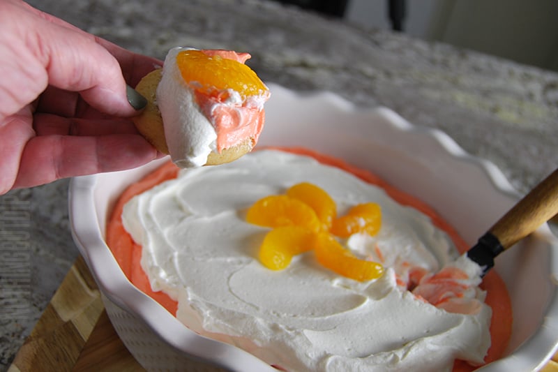 Orange creamsicle dip served on a cookie