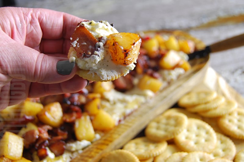 Boursin with Bacon and Grilled Pineapple Appetizer Served on a cracker