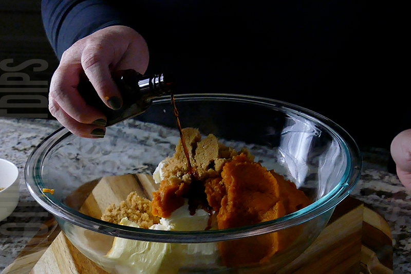 adding vanilla to the ingredients to make pumpkin cheesecake dip