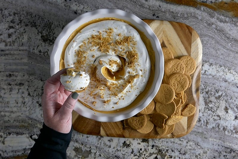 creamy pumpkin cheesecake dip served on a shortbread cookie