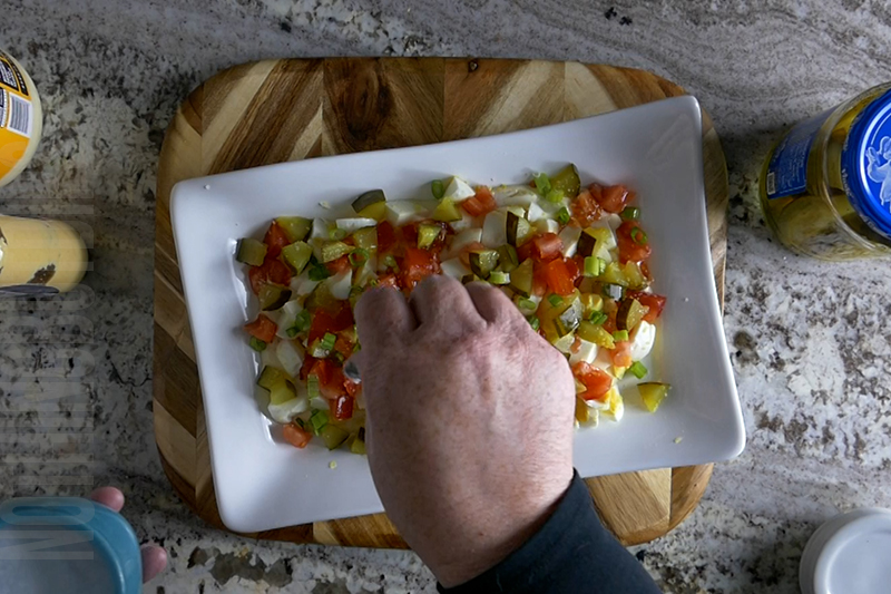 seasoning the dip with salt